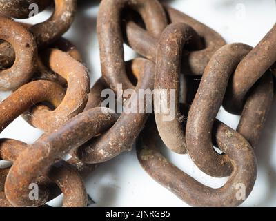 old rusted steel chains. Concept of antiquity and false security Stock Photo