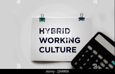 Hybrid work culture shown with text on white background Stock Photo