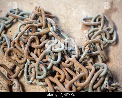 old rusted steel chains. Concept of antiquity and false security Stock Photo