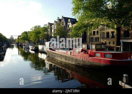 Barges on Brouwersgracht in Jordaan neighborhoud in Amsterdam