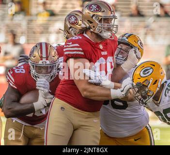 Green Bay Packers offensive tackle Billy Turner (R) grabs an Aaron Rodgers  fumble from San Francisco 49ers defensive end Nick Bosa (bottom) and  linebacker Dre Greenlaw (57) in the second quarter of