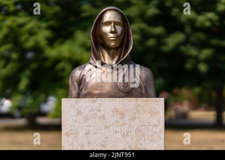 Budapest, Hungary -August 7, .2022:  Portrait of the statue of Satoshi Nakamoto mysterious founder of Bitcoin and Blockchain technology in; created by Stock Photo