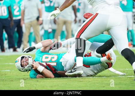 Tampa Bay, Florida, USA, August 13, 2022, Miami Dolphins Quarterback Skylar Thompson #19 gets sacked at Raymond James Stadium.  (Photo Credit:  Marty Jean-Louis) Credit: Marty Jean-Louis/Alamy Live News Stock Photo