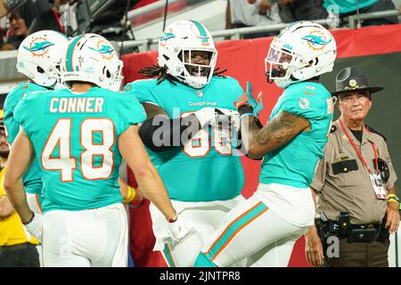 Tampa Bay, Florida, USA, August 13, 2022, Miami Dolphins players celebrate touchdown at Raymond James Stadium.  (Photo Credit:  Marty Jean-Louis) Credit: Marty Jean-Louis/Alamy Live News Stock Photo