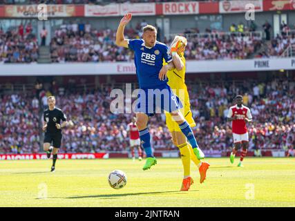 London, UK. 14th Aug, 2022. Leicester City's Jamie Vardy (Front) clashes with Arsenal's goalkeeper Aaron Ramsdale during the English Premier League match between Arsenal and Leicester City in London, Britain, on Aug. 13, 2022. Arsenal won 4-2. Credit: Xinhua/Alamy Live News Stock Photo