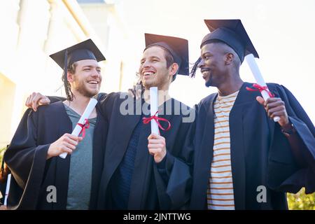 College was the best time of our lives. students on graduation day from university. Stock Photo