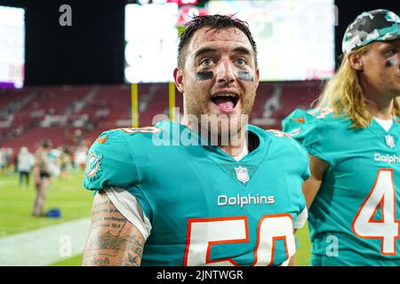 Miami Dolphins linebacker Calvin Munson (50) defends during an NFL football  game against the Miami Dolphins, Saturday, Aug. 13, 2022 in Tampa, Fla. The  Dolphins defeat the Buccaneers 26-24. (AP Photo/Peter Joneleit