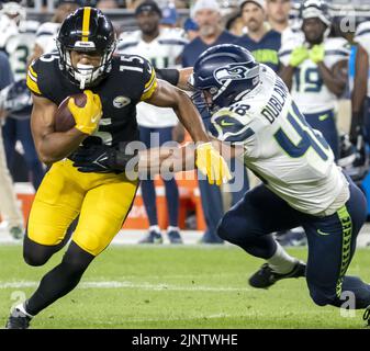 Seattle Seahawks wide receiver Laquon Treadwell (18) catches a pass and  runs against the Los Angeles Rams in an NFL football game, Sunday, Dec. 4,  2022, in Inglewood, Calif. Seahawks won 27-23. (