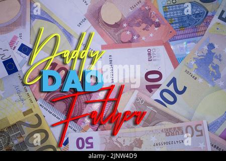 Dad word with money. Paper currency background with different banknotes. Stock Photo