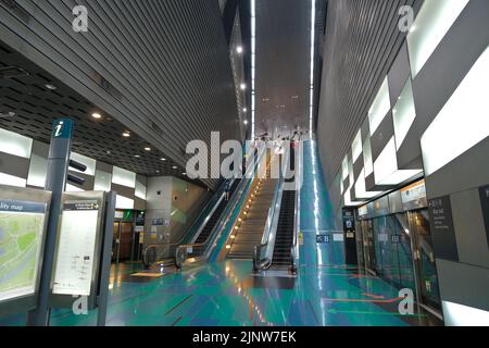 Escalators leading to the platform level of the Stadium MRT Station along the Circle Line, Singapore Stock Photo