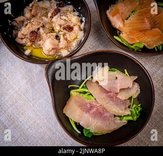 raw fish appetizers: sarde in saor, fresh lake char and fresh salmon - typical Venetian dish raw fish appetizers: sarde in saor, fresh lake char and fresh salmon - typical Venetian dish