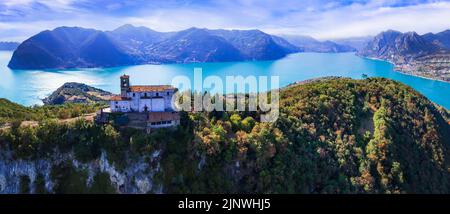 Italian lakes scenery. Amazing Iseo lake aerial drone view.  one of the most beautiful places - Shrine of Madonna della Ceriola in Monte Isola - sceni Stock Photo