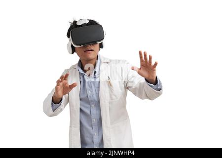 Young peruvian male scientific using virtual reality headset, isolated. Stock Photo