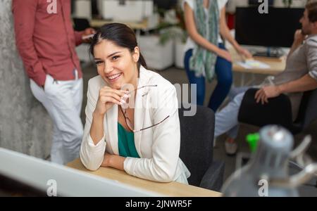 Group of software engineers working developing applications together in corporate office Stock Photo