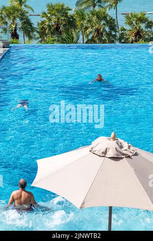 Swimming pool at beachfront hotel, Pattaya, Chon Buri, Thailand Stock Photo
