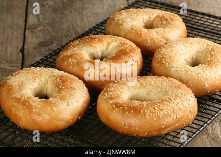 fresh bagels cooling on a ack Stock Photo