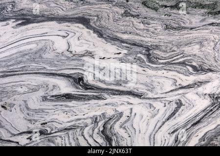 Volcano White, grey polished granite stone slab for perfect interior. Stock Photo