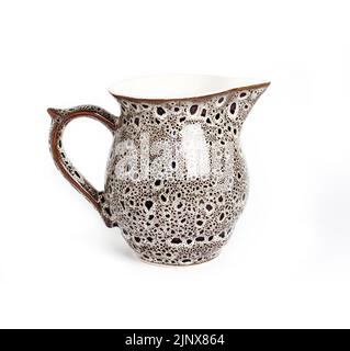 Glazed ceramic milk jar isolated on a white background Stock Photo