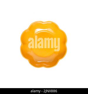 Yellow ceramic plate isolated on white background. Flat lay, top view Stock Photo