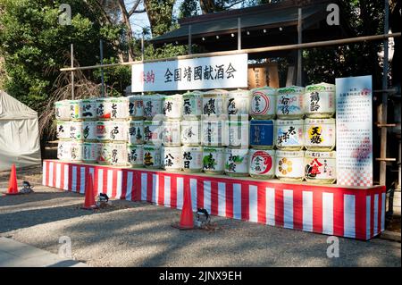 Chiyoda City, Tokyo, Japan - January 02, 2020: Consecrated traditional sake barrels stacked at Yasukuni Shrine. Stock Photo