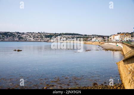 Penzance,Cornwall,13th August 2022,People enjoy the glorious sunshine in Penzance, Cornwall as they strolled along the Promenade. The temperature was Stock Photo