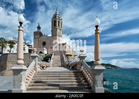 Stairs to get to the church of Sitges, next to the Mediterranean sea in Catalonia Spain, very sunny day during the summer time and no tourists in. Stock Photo