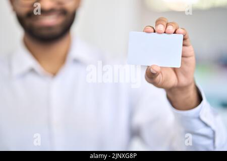 Business man holding namecard showing business card white mockup. Stock Photo