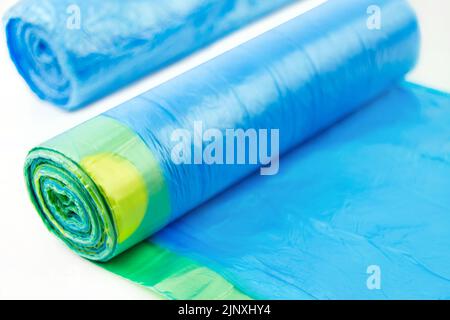 Two blue garbage bags on white background Stock Photo