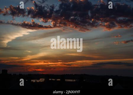 Cloud patterns at twilight over Cornwall, the sun is below the distant horizon. Stock Photo