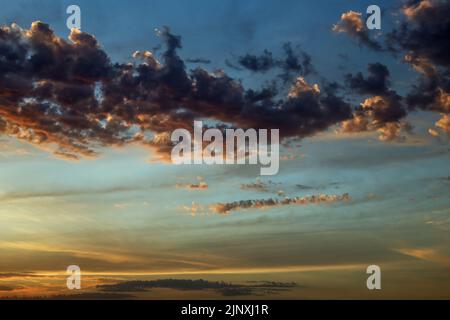Cloud patterns at twilight over Cornwall, the sun is below the distant horizon. Stock Photo