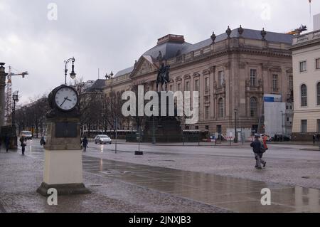 Berlin, Germany: Unter den Linden boulevard, equestrian statue of Frederick the Great and State Library Stock Photo