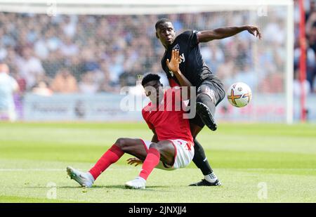 Nottingham, UK. 14th Aug, 2022. Taiwo Awoniyi of Nottingham Forest (left) and Kurt Zouma of West Ham during the Premier League match at the City Ground, Nottingham. Picture credit should read: Andrew Yates/Sportimage Credit: Sportimage/Alamy Live News Stock Photo