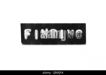 Black color banner that have embossed letter with word finding on white paper background Stock Photo