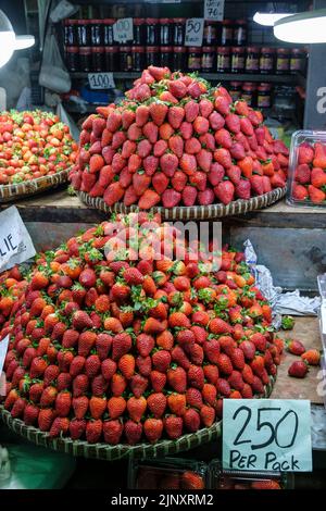Baguio, Philippines - August 2022: Strawberry stand in Baguio market on August 4, 2022 in Baguio, Luzon, Philippines. Stock Photo