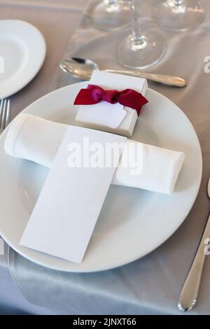 Wedding table set up with menu and guest placement Stock Photo