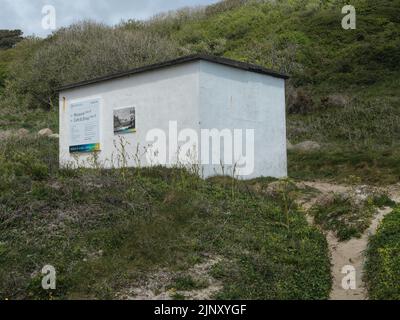 The telegraph cable hut at the top of Porthcurno beach Stock Photo