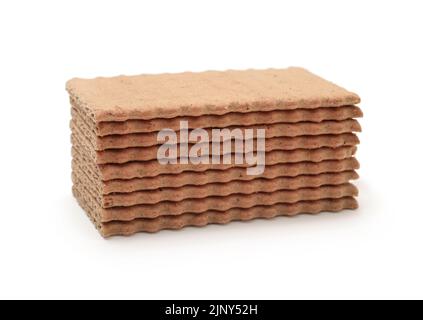 Stack of brown rye crispy bread isolated on white. Stock Photo