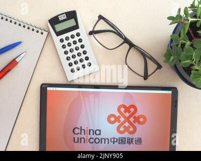 In this photo illustration, China Unicom Group Co., Ltd. logo seen displayed on a tablet Stock Photo