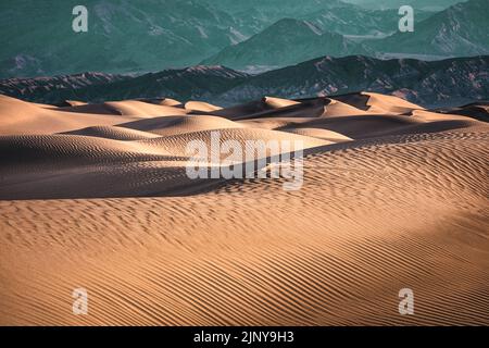 Mesquite Flat Sand Dunes stretch across the valley floor in Death Valley National Park, California. Stock Photo