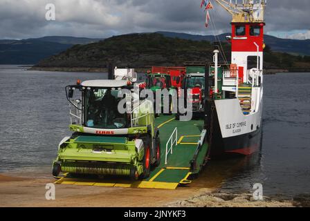 A forage harvester, tractors and trailers disembark the 'MV Isle of Cumbrae'  Tarbert to Portavadie Calmac ferry on Loch Fyne, Argyll, Scotland, UK. Stock Photo