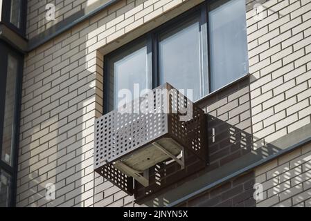Building with decorative air conditioner covers Stock Photo