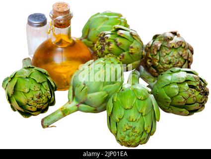 Green artichokes, oil and salt Stock Photo