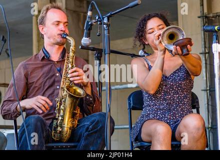 NEW ORLEANS, LA, USA - NOVEMBER 18, 2017: Male saxophonist and female cornet player from the band, Tuba Skinny, perform at Treme Creole Gumbo Fest Stock Photo