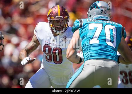 August 13, 2022 Washington Commanders defensive end Montez Sweat (90) rushes the passer during the preseason game between the Carolina Panthers and Washington Commanders played at Fed Ex Field in Landover, MD. Photographer: Cory Royster Stock Photo