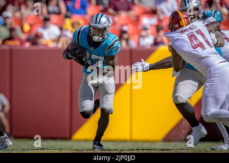 Carolina Panthers running back John Lovett (37) runs between Buffalo Bills  defensive tackle Prince Emili (94) and inebacker Andre Smith (9) during an  NFL preseason football game on Friday, Aug. 26, 2022