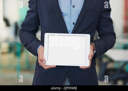 Are you sure youre handling business the smartest way. Closeup shot of an unrecognizable businessman holding up a digital tablet with a blank screen Stock Photo