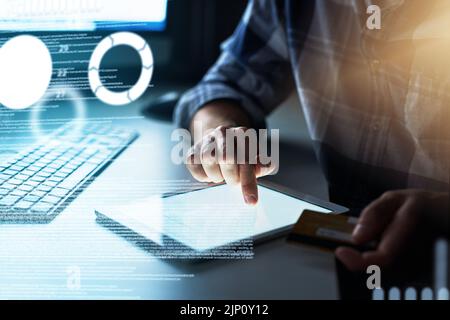 Software hacker using tablet, bank or credit card information technology for hacking, stealing or cyber crime with virus or malware encryption coding Stock Photo