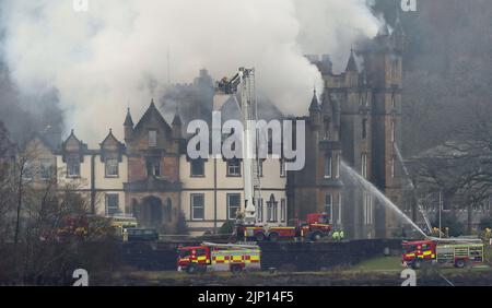 File photo dated 18/12/2017 of firefighters at the scene following a fire at the Cameron House Hotel on the banks of Loch Lomond in Scotland. A fatal accident inquiry (FAI) into the deaths of two men in the fire at Cameron House in 2017 will commence on Monday. The inquiry, held at Paisley Sheriff Court, will look at issues around guest and fire safety at the hotel on the banks of Loch Lomond following the fatal fire in December 2017. Cameron House was previously fined £500,000 following the deaths of Simon Midgley, 32, and his partner Richard Dyson, 38, from London. Issue date: Monday August  Stock Photo