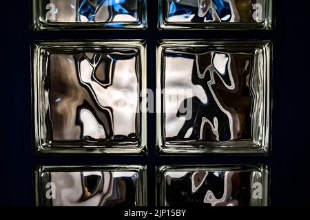 Glass Block Wall,Transparent glass block or tiled mosaic wall for background.Perfect for texture, background, or as a design element. Stock Photo