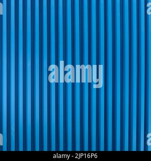 Background of blue vertical metal strips. Stock Photo